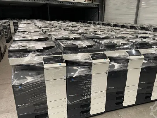 Rows of ex-lease photocopiers wrapped and ready to ship